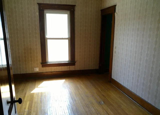 a view of an empty room and window