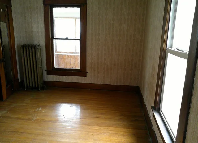 a view of an empty room with a window