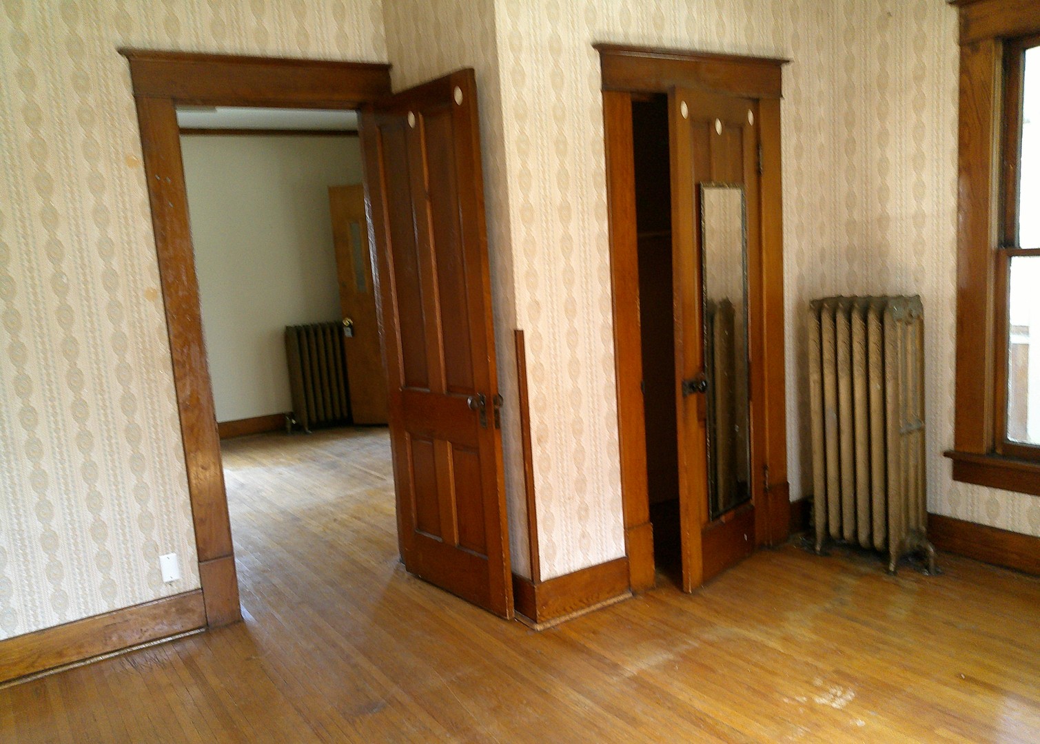 208 East State Street Fairmount, IL 61841 - Photo 14 of 21 an empty room with wooden floor and closet