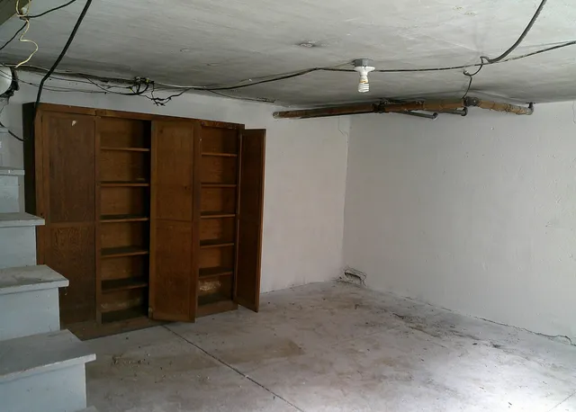 a view of walk in closet with clothes