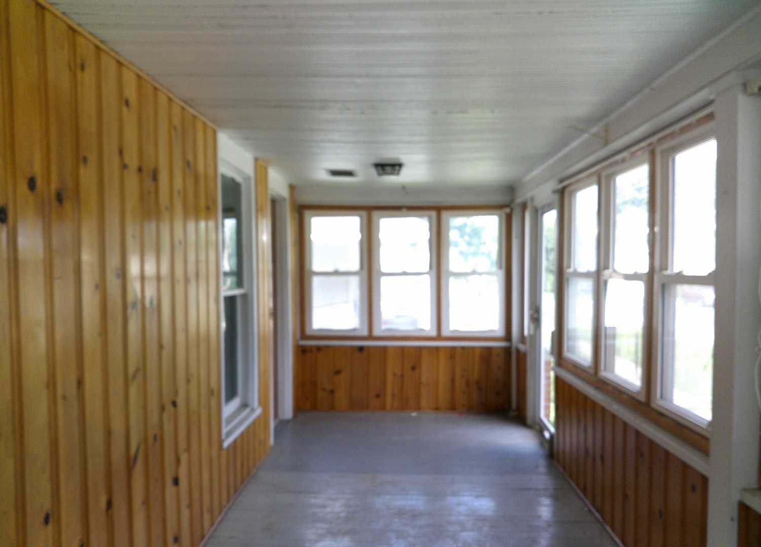 208 East State Street Fairmount, IL 61841 - Photo 2 of 21 a view of an empty room with a window