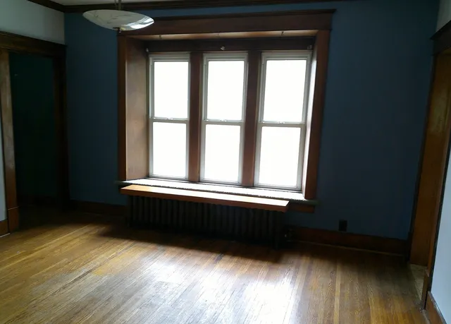 a bathroom with a bathtub and a window