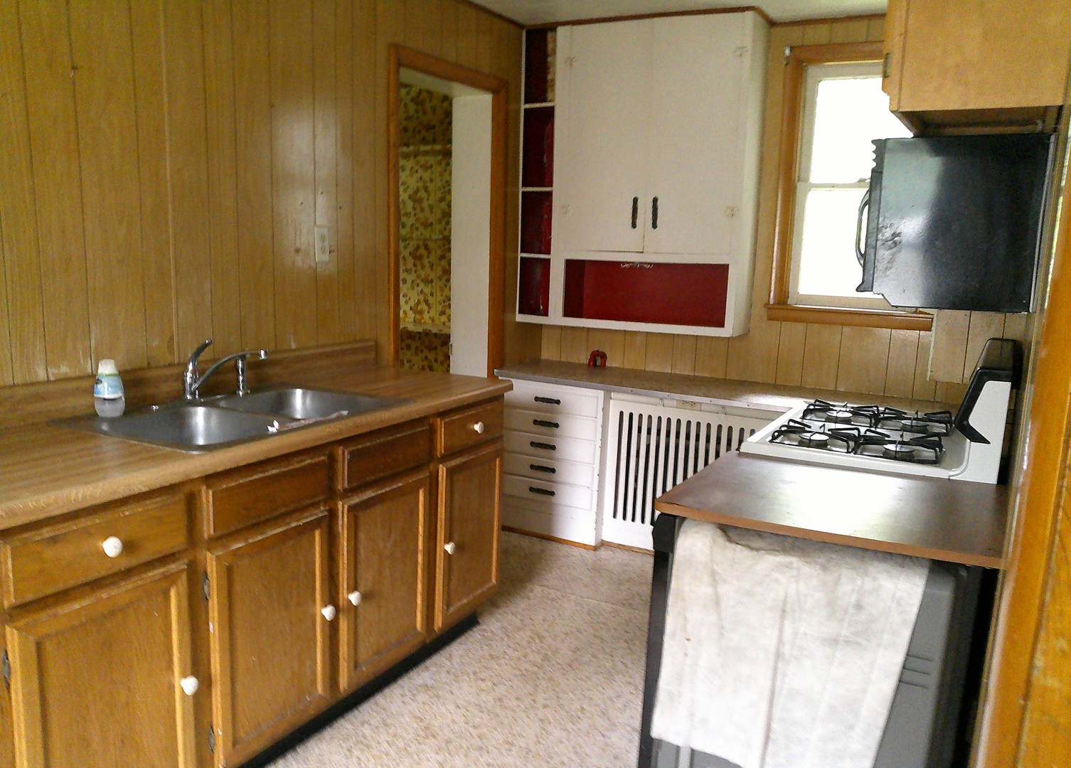 208 East State Street Fairmount, IL 61841 - Photo 8 of 21 a kitchen with stainless steel appliances a stove and a refrigerator