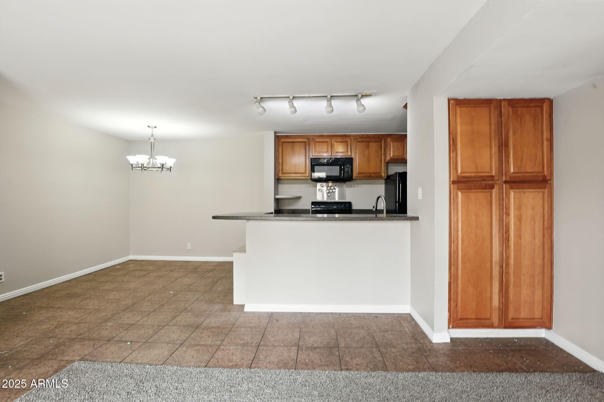 8055 East Thomas Road, Unit N201 Scottsdale, AZ 85251 - Photo 11 of 28 a view of kitchen with refrigerator and window