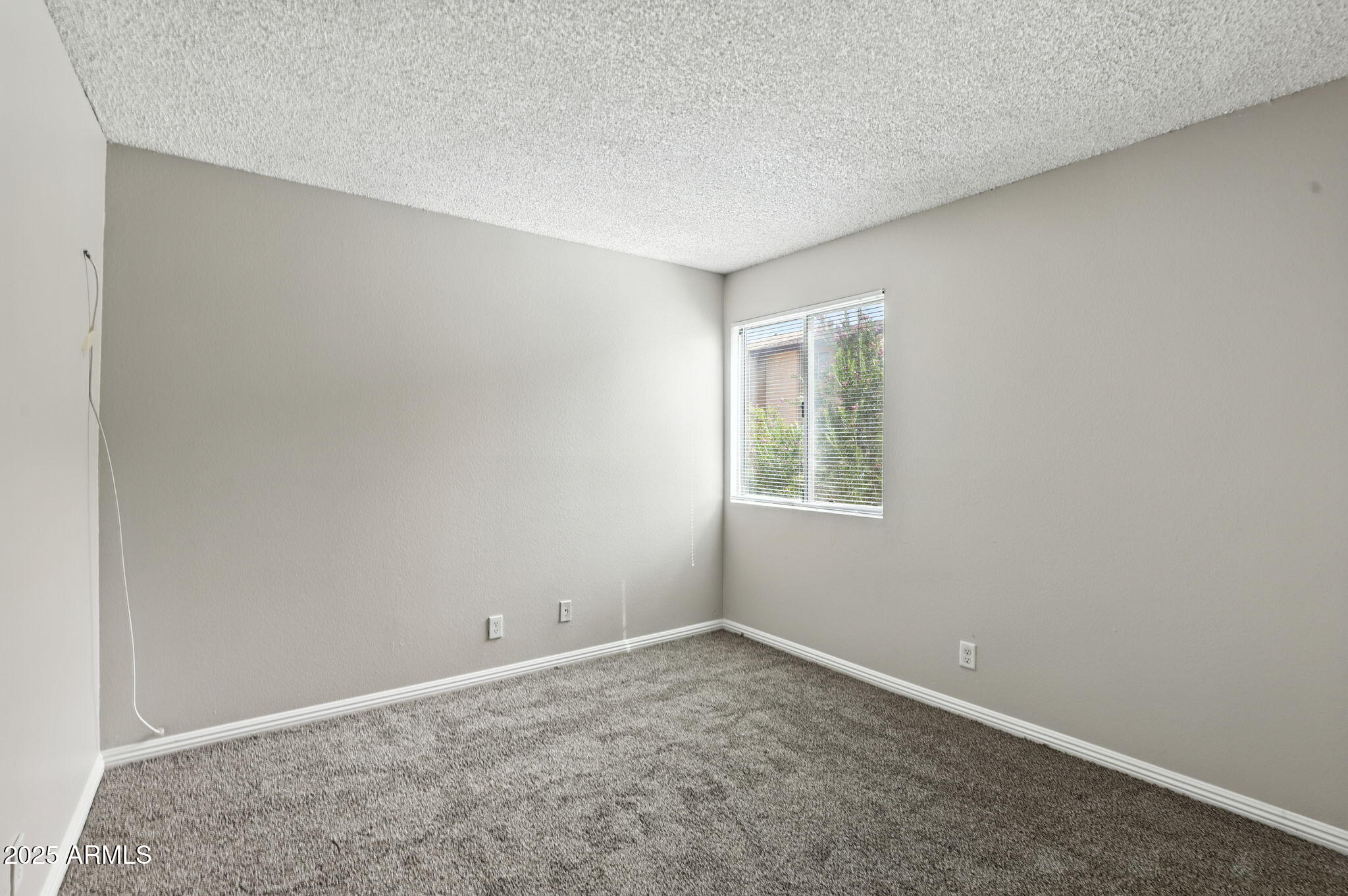 8055 East Thomas Road, Unit N201 Scottsdale, AZ 85251 - Photo 17 of 28 an empty room with a window