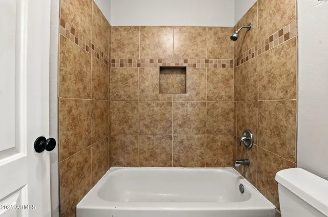 a bathroom with a bath tub