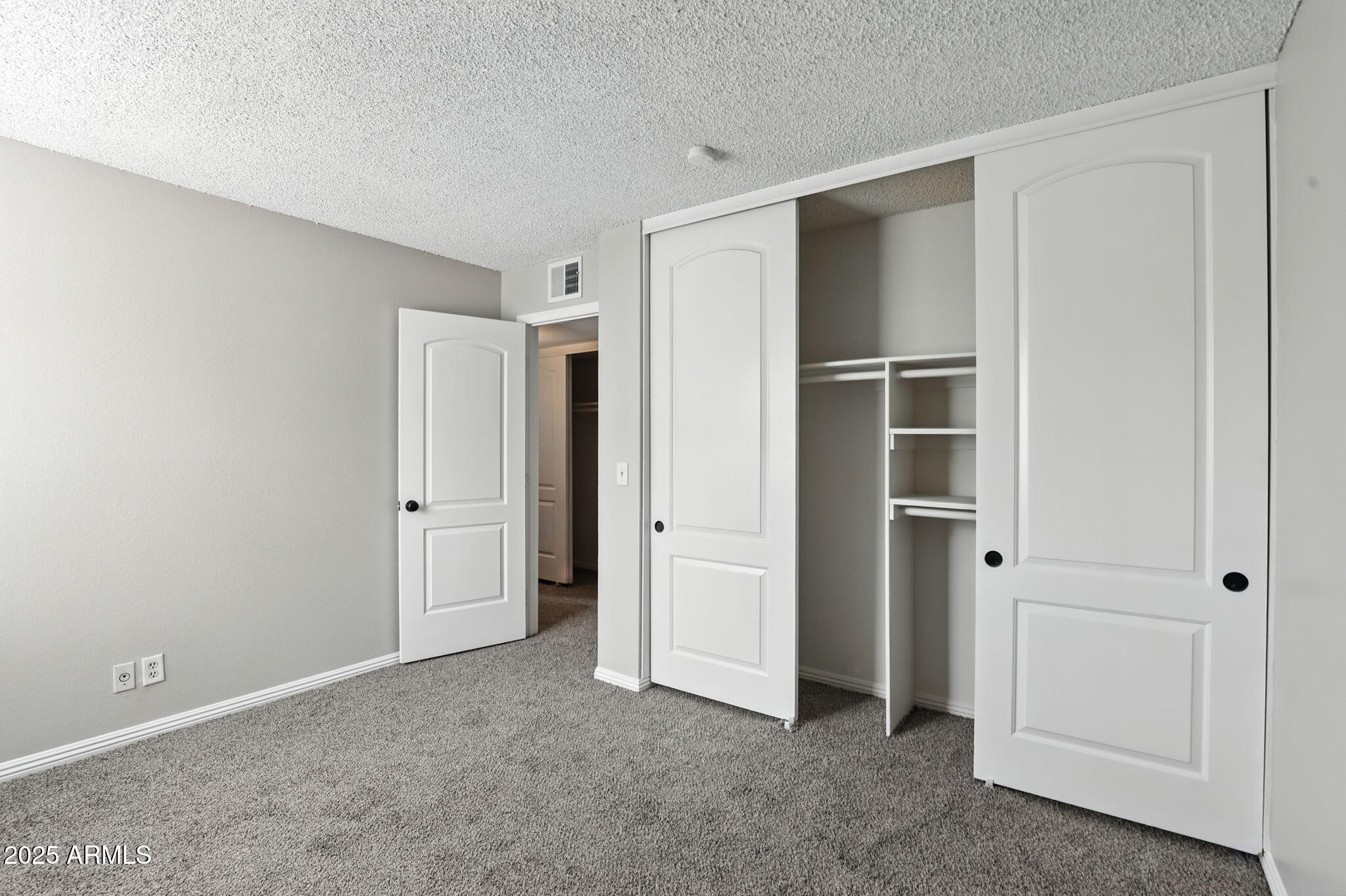 8055 East Thomas Road, Unit N201 Scottsdale, AZ 85251 - Photo 22 of 28 a view of an empty room with closet area