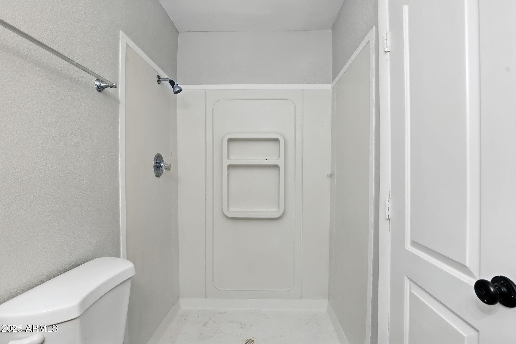 8055 East Thomas Road, Unit N201 Scottsdale, AZ 85251 - Photo 26 of 28 a bathroom with a shower a toilet and a sink