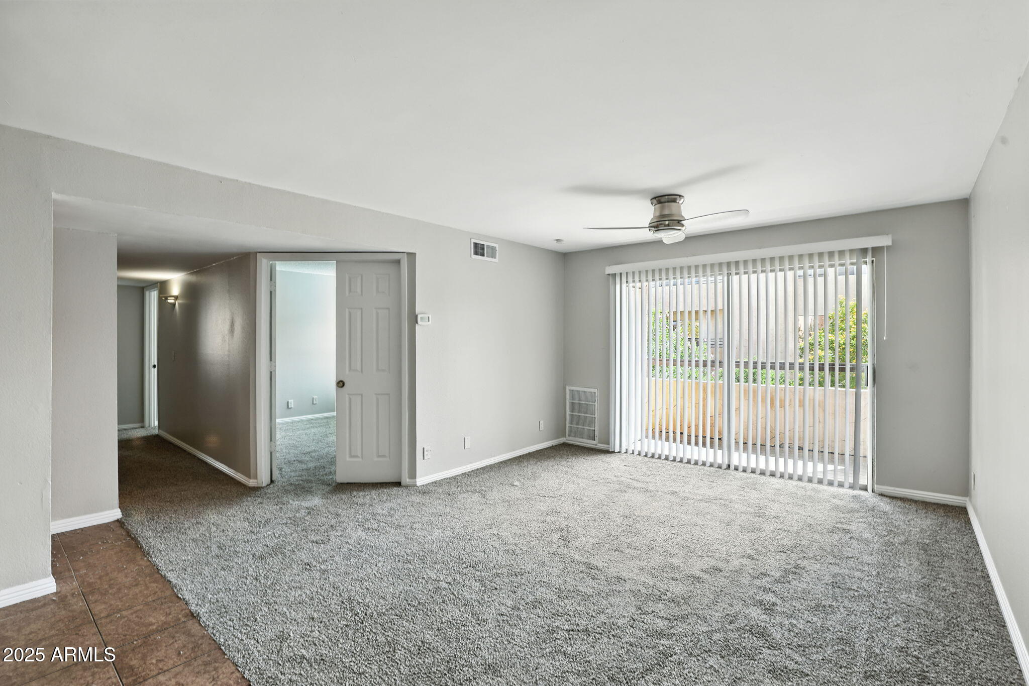 8055 East Thomas Road, Unit N201 Scottsdale, AZ 85251 - Photo 9 of 28 a view of an empty room with glass door