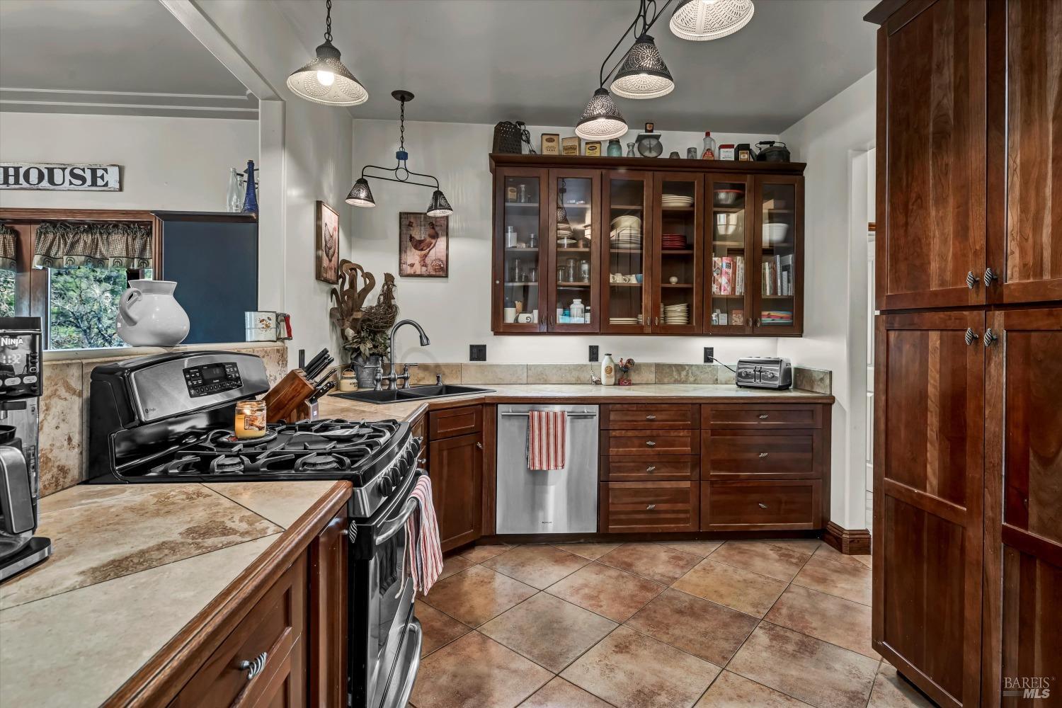 5963 Eickhoff Road Lakeport, CA 95453 - Photo 13 of 51 a kitchen with a stove and a refrigerator