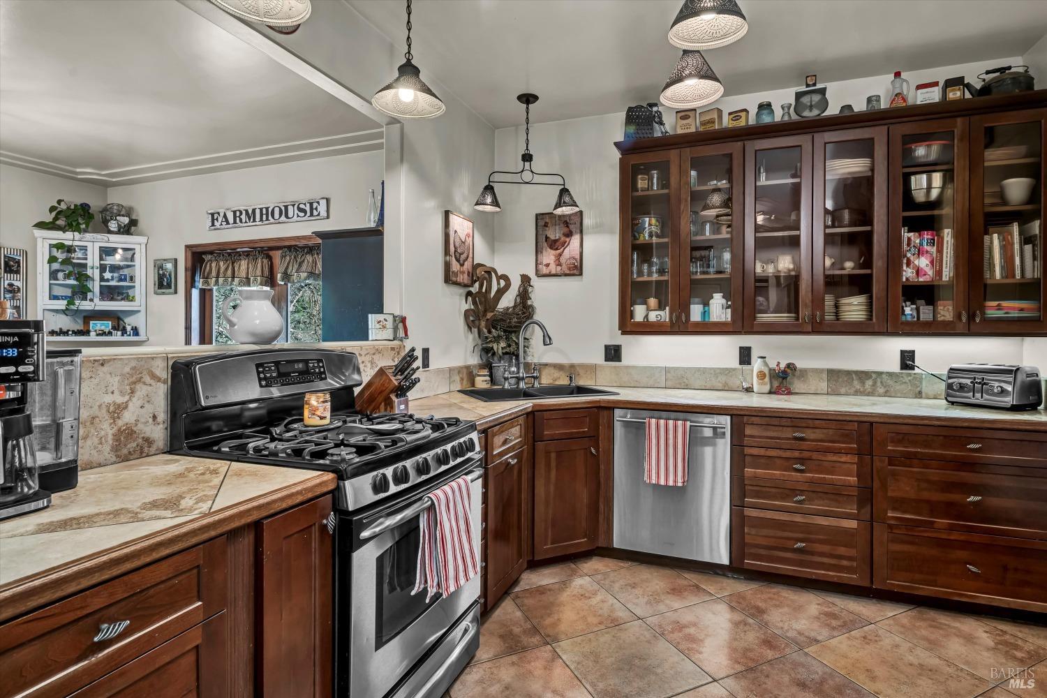 5963 Eickhoff Road Lakeport, CA 95453 - Photo 14 of 51 a kitchen with a stove and a sink