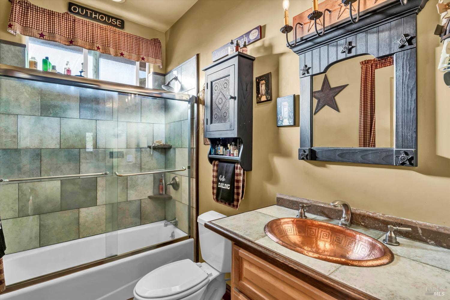 5963 Eickhoff Road Lakeport, CA 95453 - Photo 19 of 51 a bathroom with a sink a toilet and shower