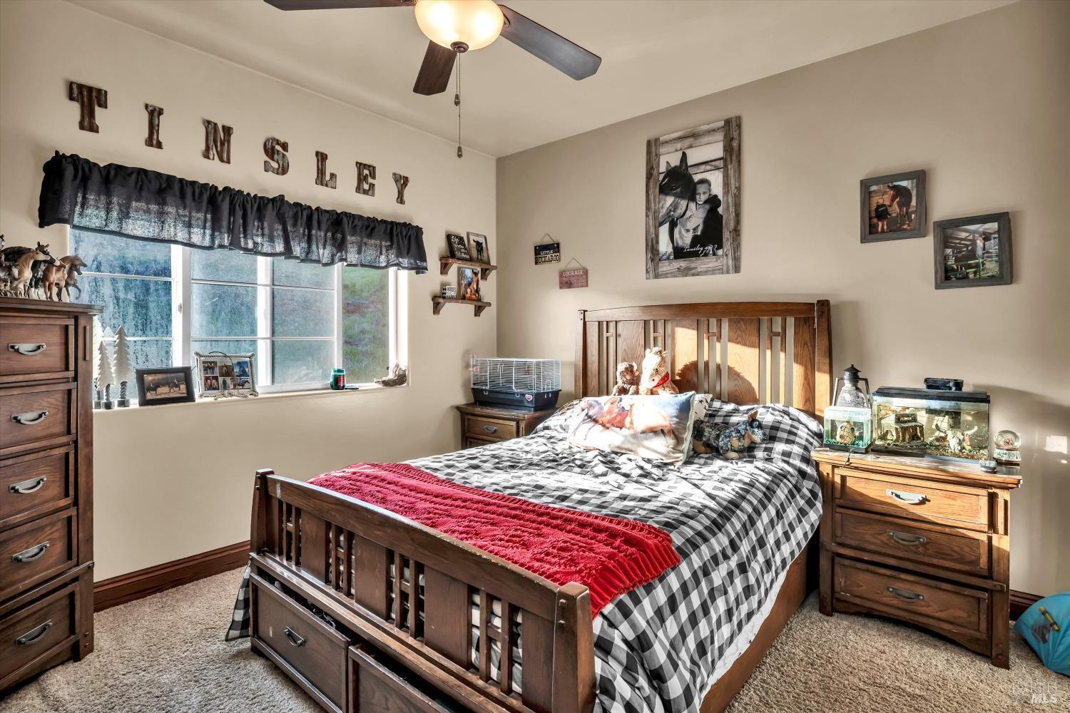 5963 Eickhoff Road Lakeport, CA 95453 - Photo 20 of 51 a bedroom with a bed and a window