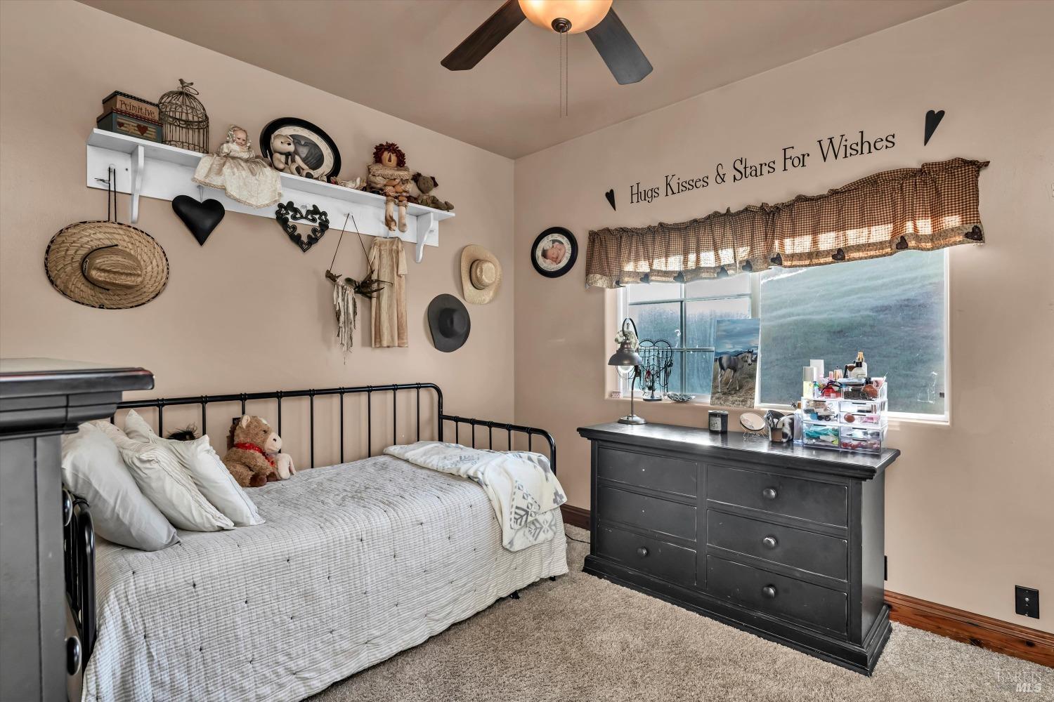 5963 Eickhoff Road Lakeport, CA 95453 - Photo 22 of 51 a bed room with a bed and a large window