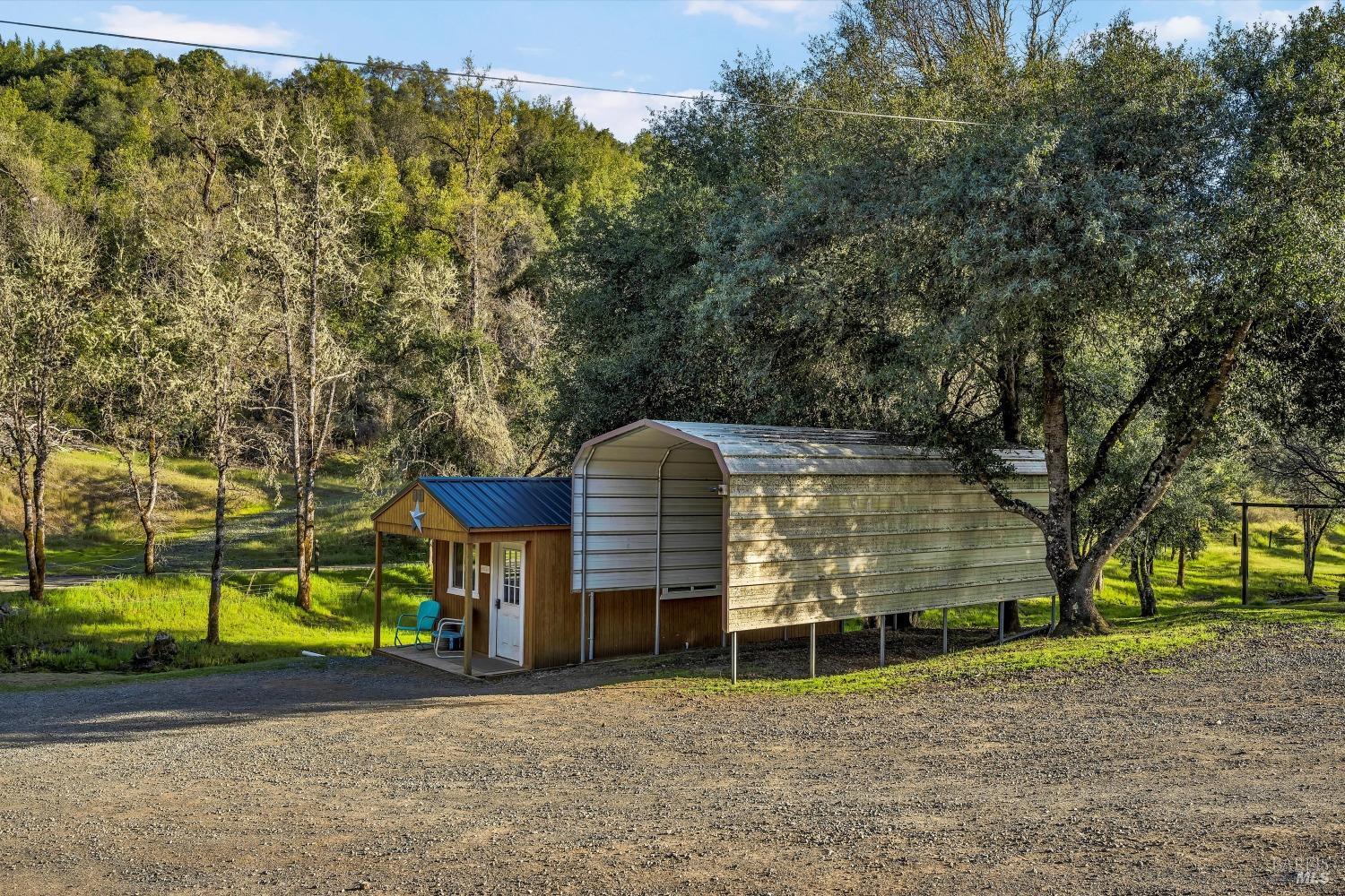 5963 Eickhoff Road Lakeport, CA 95453 - Photo 31 of 51 a front view of a house with a yard