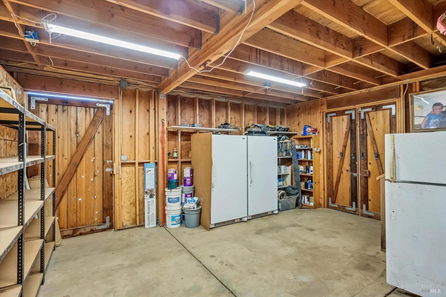 5963 Eickhoff Road Lakeport, CA 95453 - Photo 35 of 51 a view of a storage room with refrigerator and washer