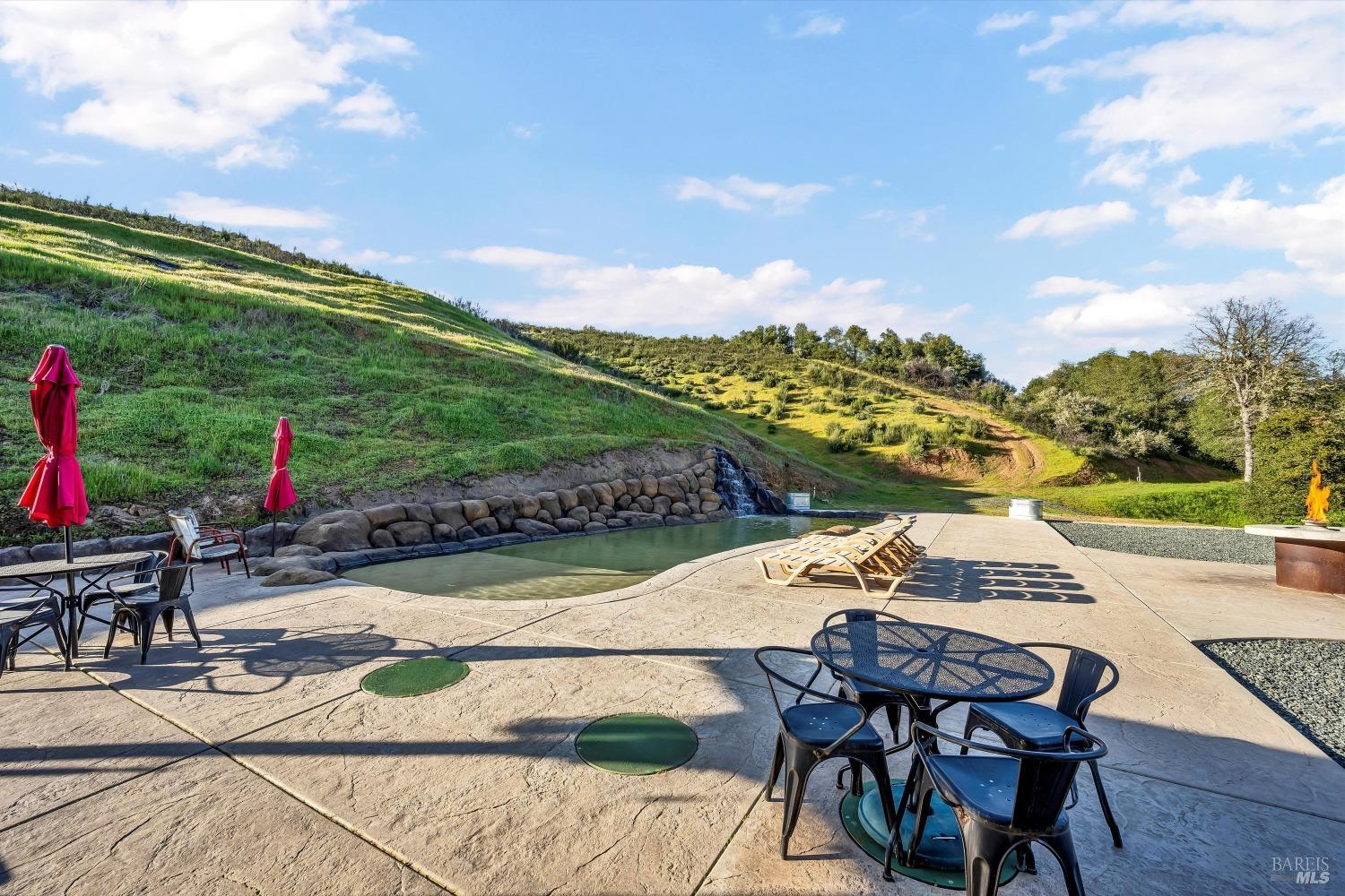 5963 Eickhoff Road Lakeport, CA 95453 - Photo 40 of 51 a view of a patio with table and chairs and potted plants