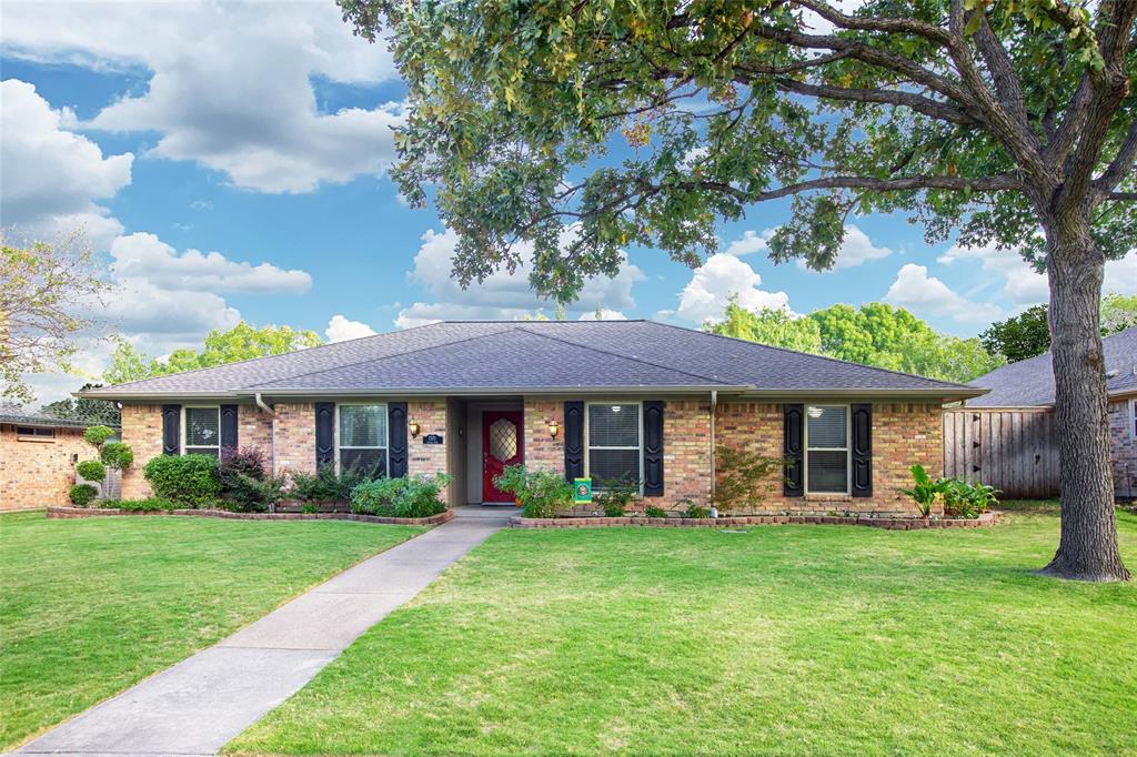 2321 Castle Rock Road Carrollton, TX 75007 - Photo 1 of 1 a front view of house with yard and green space