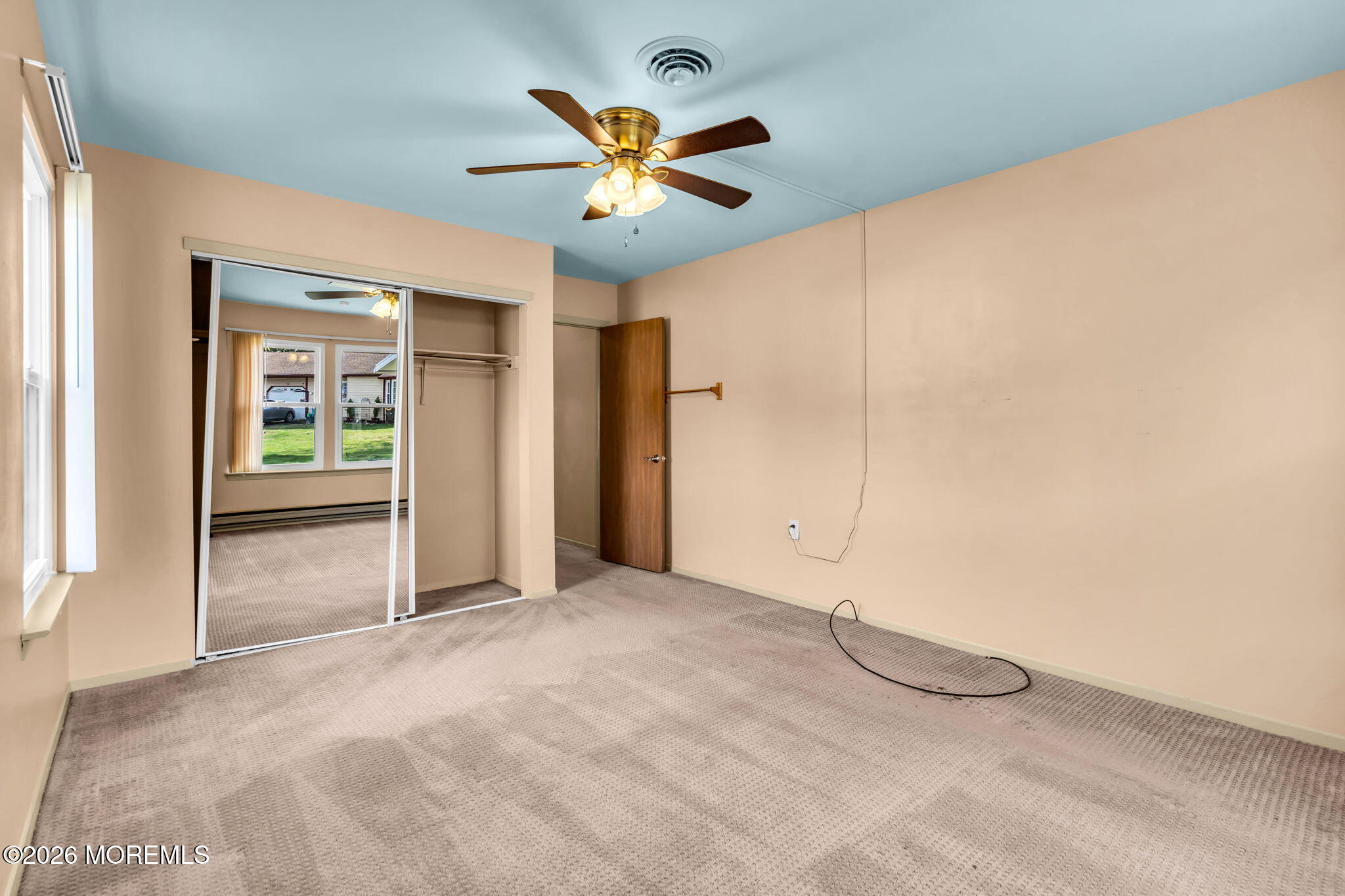 20B Amesbury Road, Unit B Whiting, NJ 08759 - Photo 13 of 25 a view of a livingroom with a ceiling fan and window