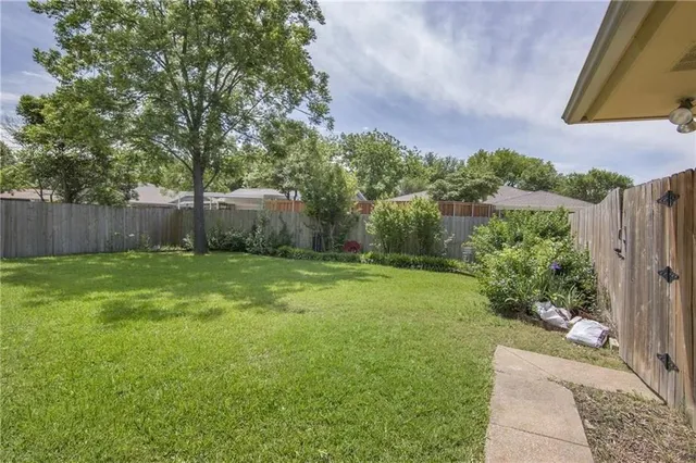 a backyard of a house with lots of green space