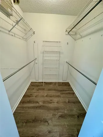 a view of an empty walk in closet