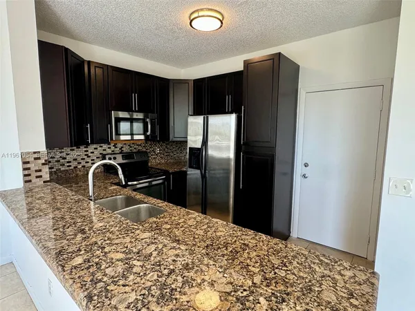 a view of a livingroom with a furniture