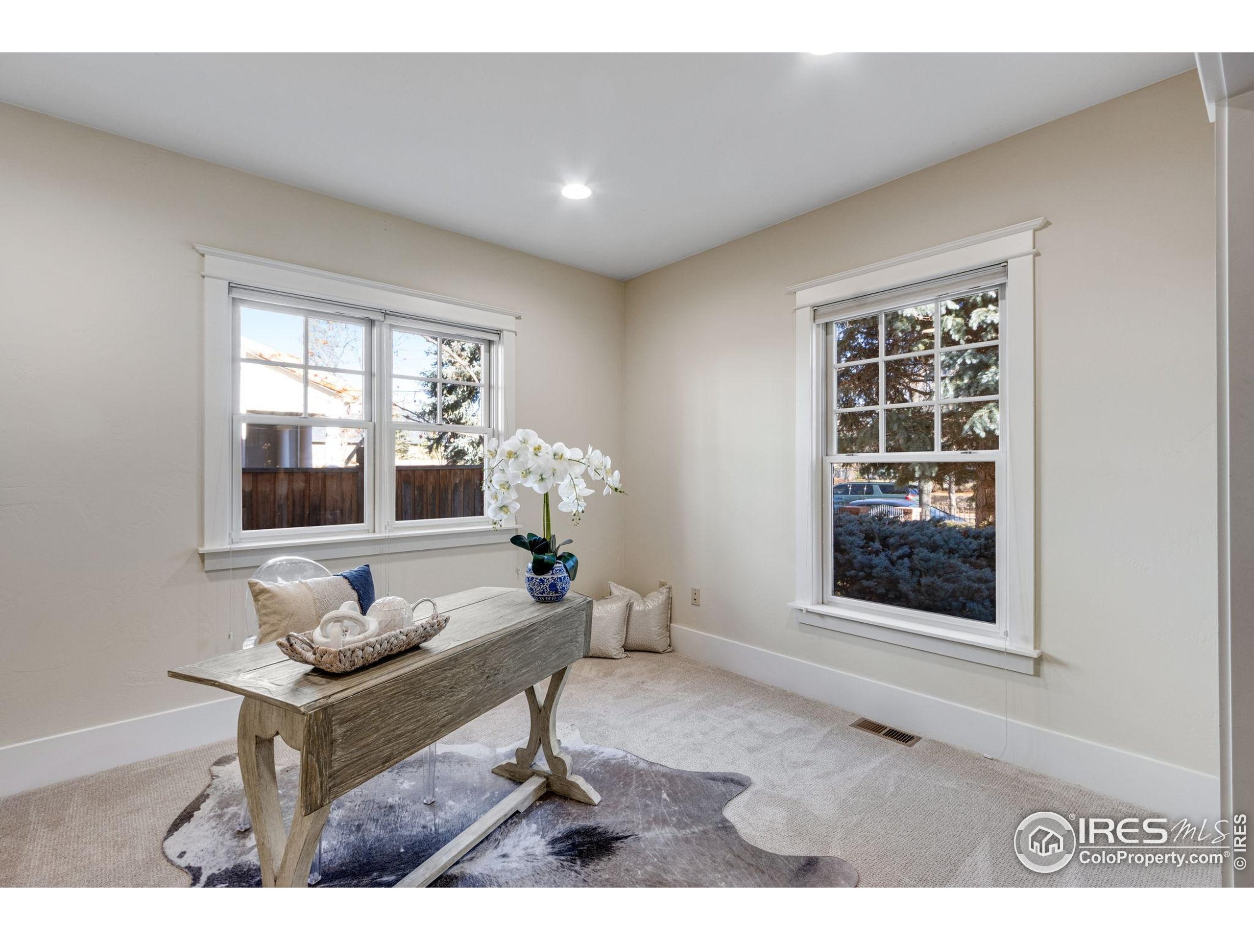 707 South Fillmore Street Denver, CO 80209 - Photo 14 of 49 a living room with furniture and a window