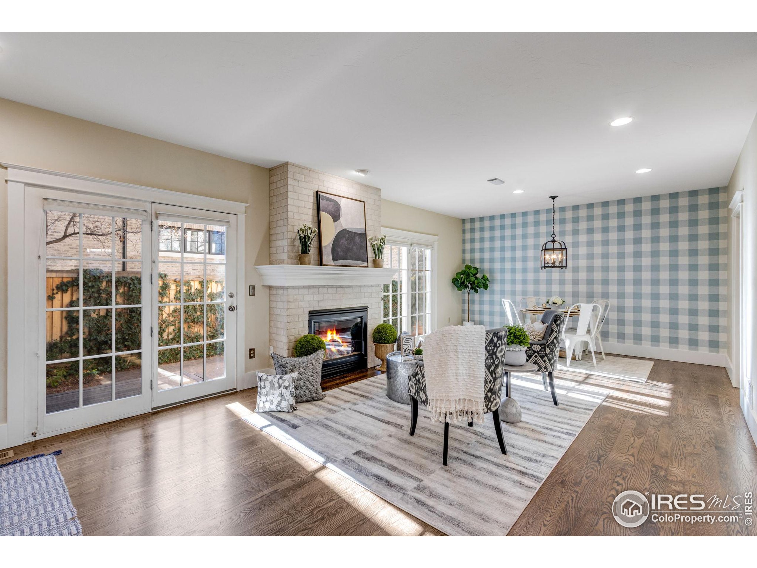 707 South Fillmore Street Denver, CO 80209 - Photo 24 of 49 a living room with furniture a fireplace and a table