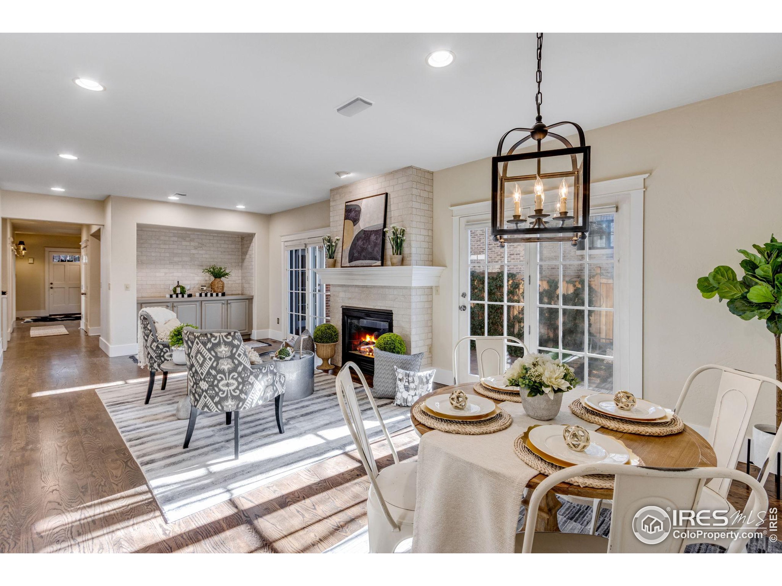 707 South Fillmore Street Denver, CO 80209 - Photo 26 of 49 a living room with furniture a dining table and a fireplace