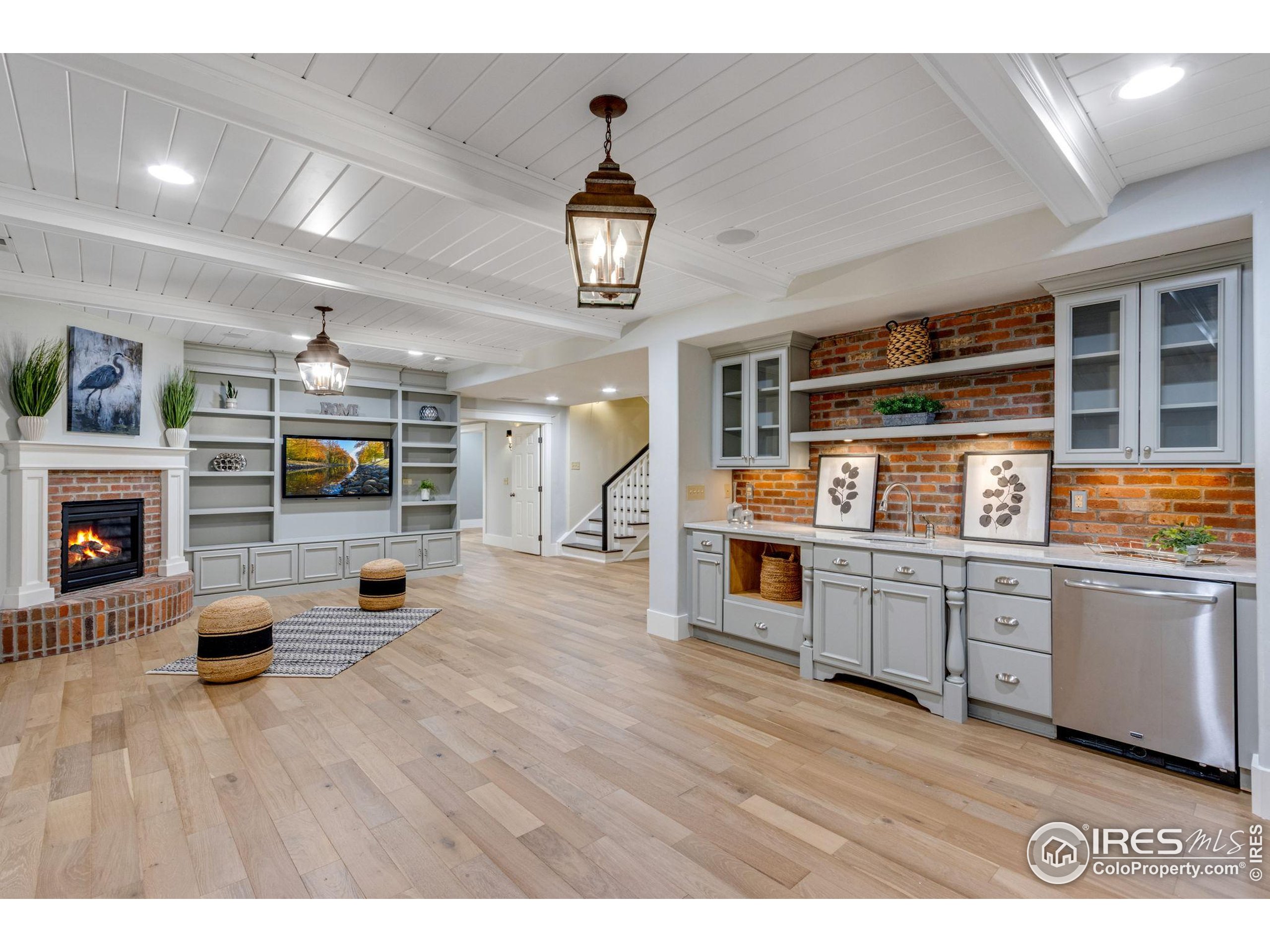 707 South Fillmore Street Denver, CO 80209 - Photo 46 of 49 a living room with furniture and a fireplace