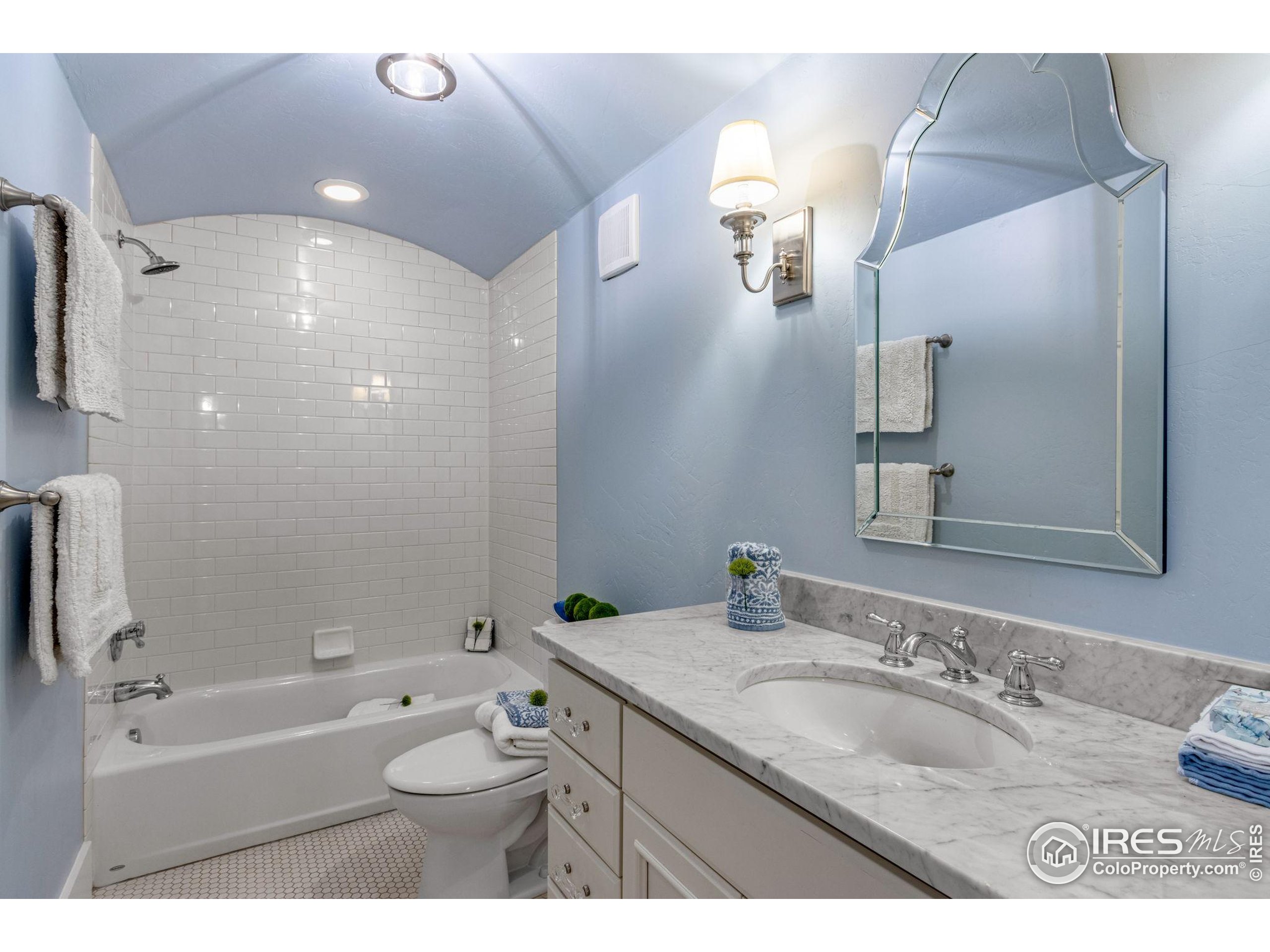 707 South Fillmore Street Denver, CO 80209 - Photo 48 of 49 a bathroom with a granite countertop sink toilet and shower