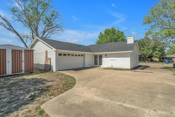 a house with a tree in front of it