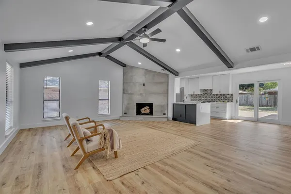a view of a livingroom with furniture and a fireplace