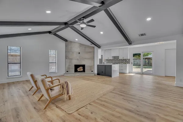a view of a livingroom with furniture and a fireplace