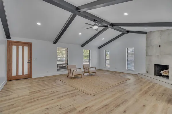 a view of a livingroom with furniture and a fireplace