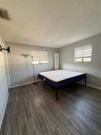 a view of a livingroom with furniture and wooden floor