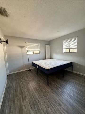 a view of a livingroom with furniture and wooden floor