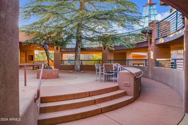 a outdoor space with lots of tables and chairs