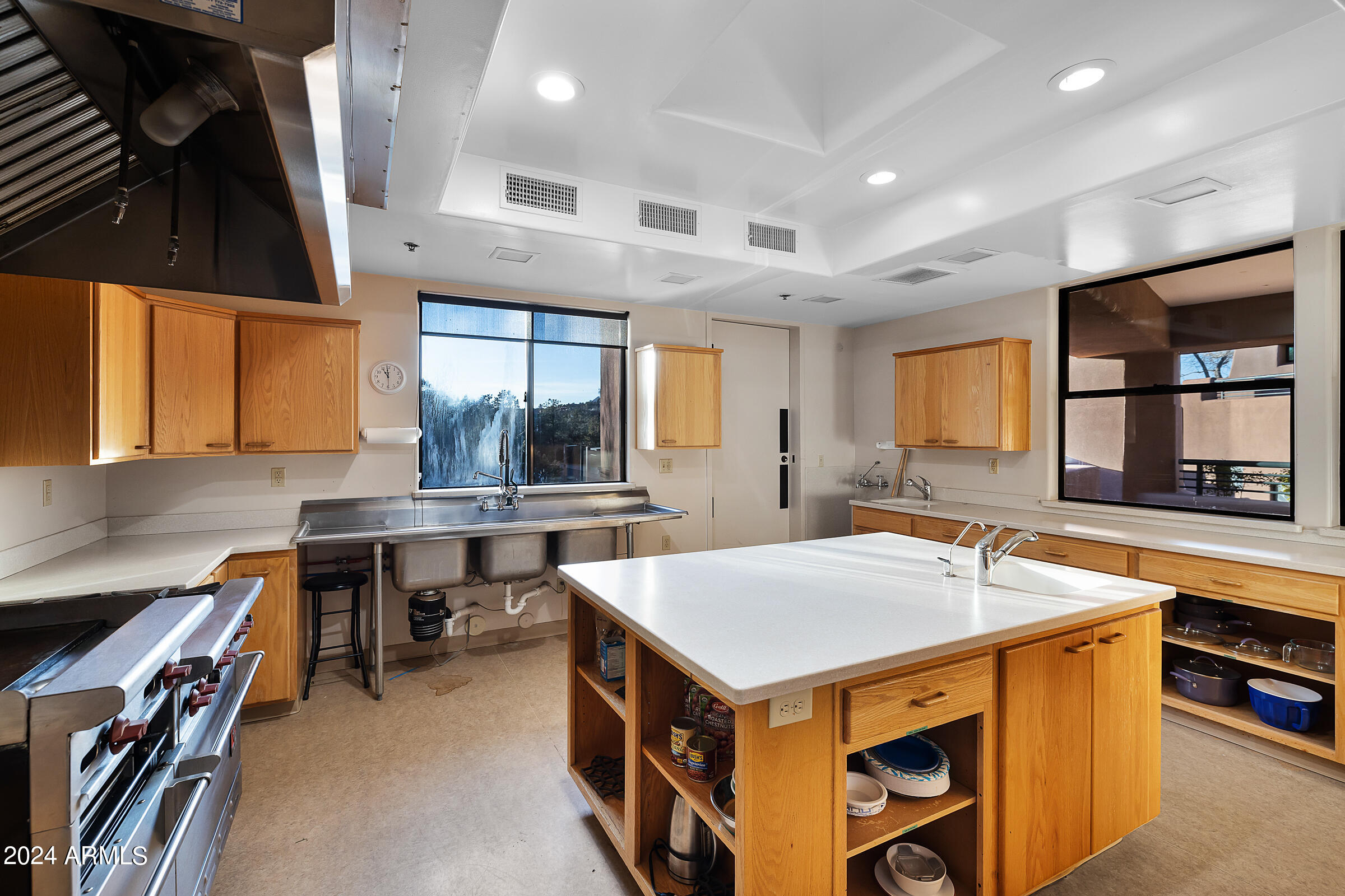 333 Schnebly Hill Road Sedona, AZ 86336 - Photo 41 of 69 a kitchen that has a sink a stove and a table in it