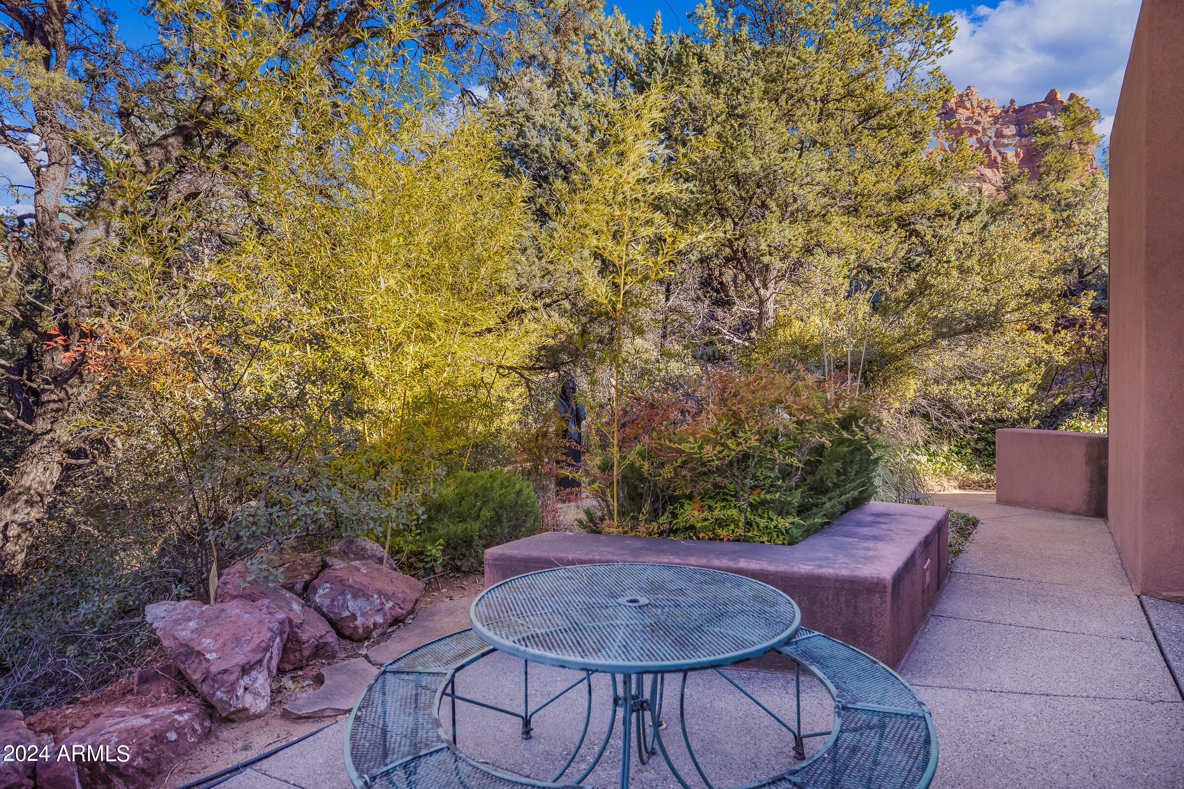 333 Schnebly Hill Road Sedona, AZ 86336 - Photo 43 of 69 a backyard of a house with table and chairs