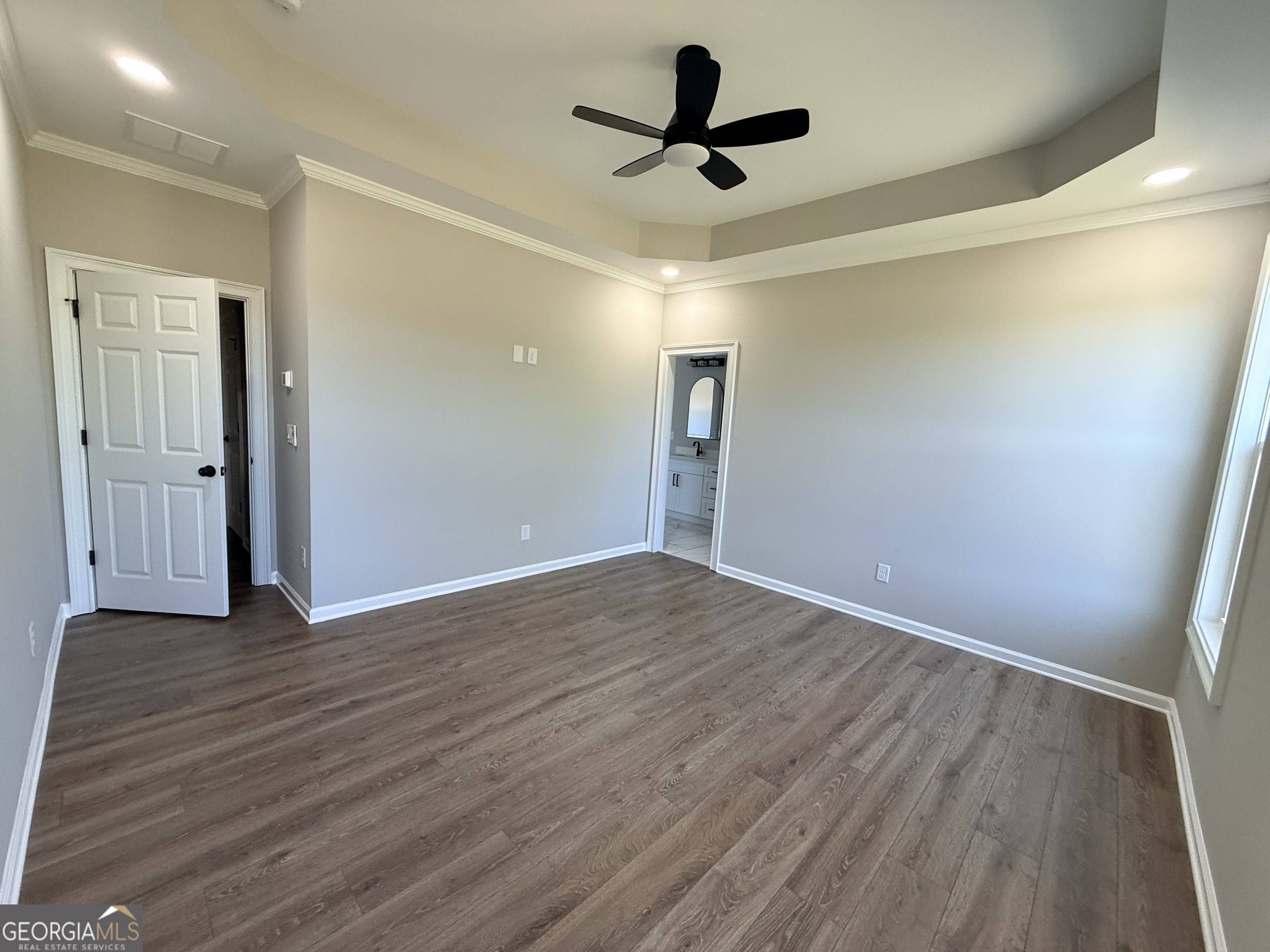 1205 Rocky Creek Road Hampton, GA 30228 - Photo 19 of 55 a view of empty room with wooden floor