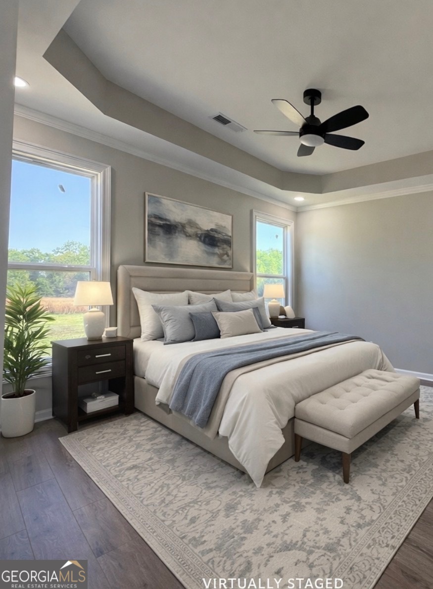 1205 Rocky Creek Road Hampton, GA 30228 - Photo 22 of 55 a bedroom with a bed and ceiling fan