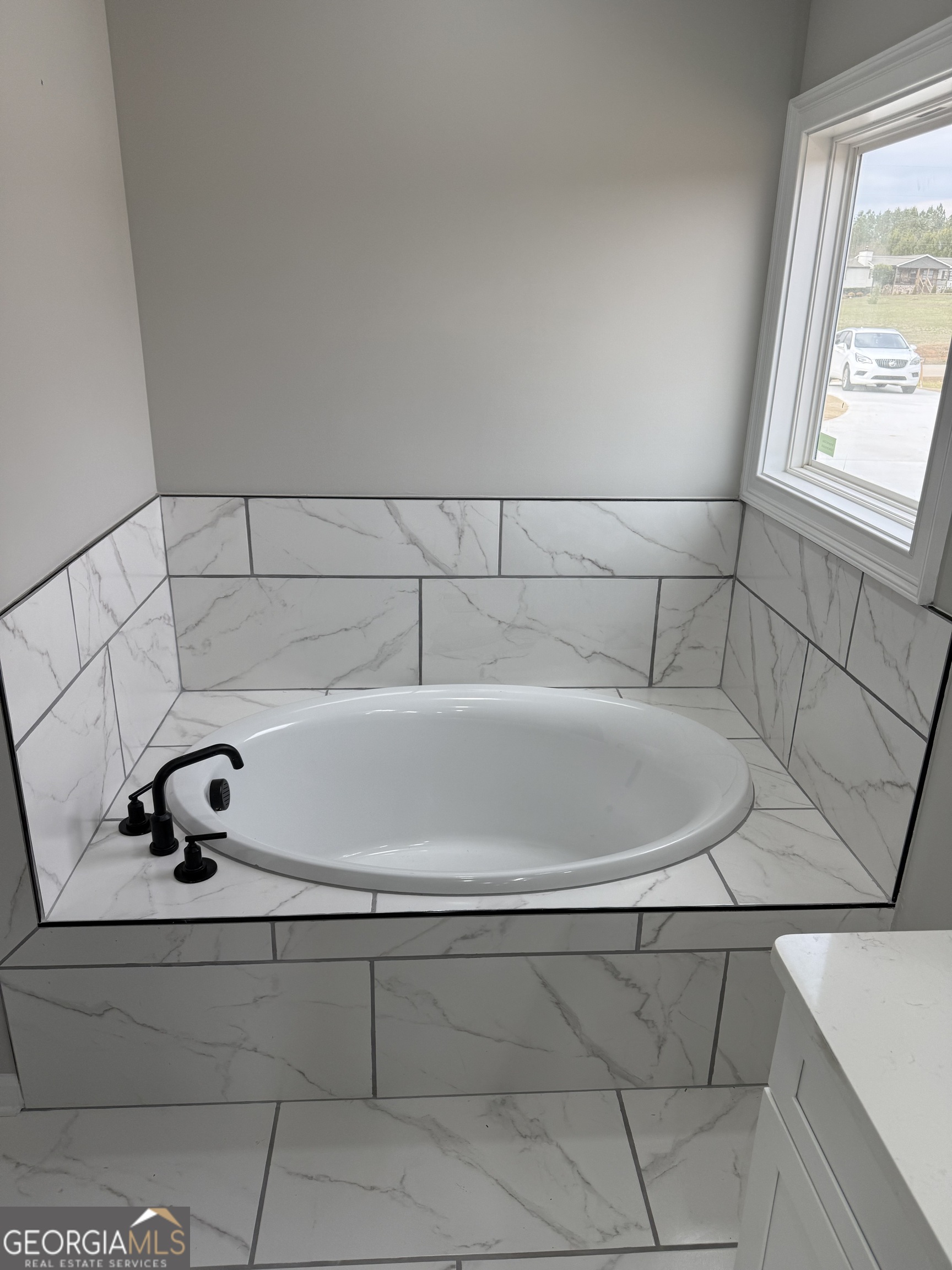 1205 Rocky Creek Road Hampton, GA 30228 - Photo 24 of 55 a bathroom with a bathtub