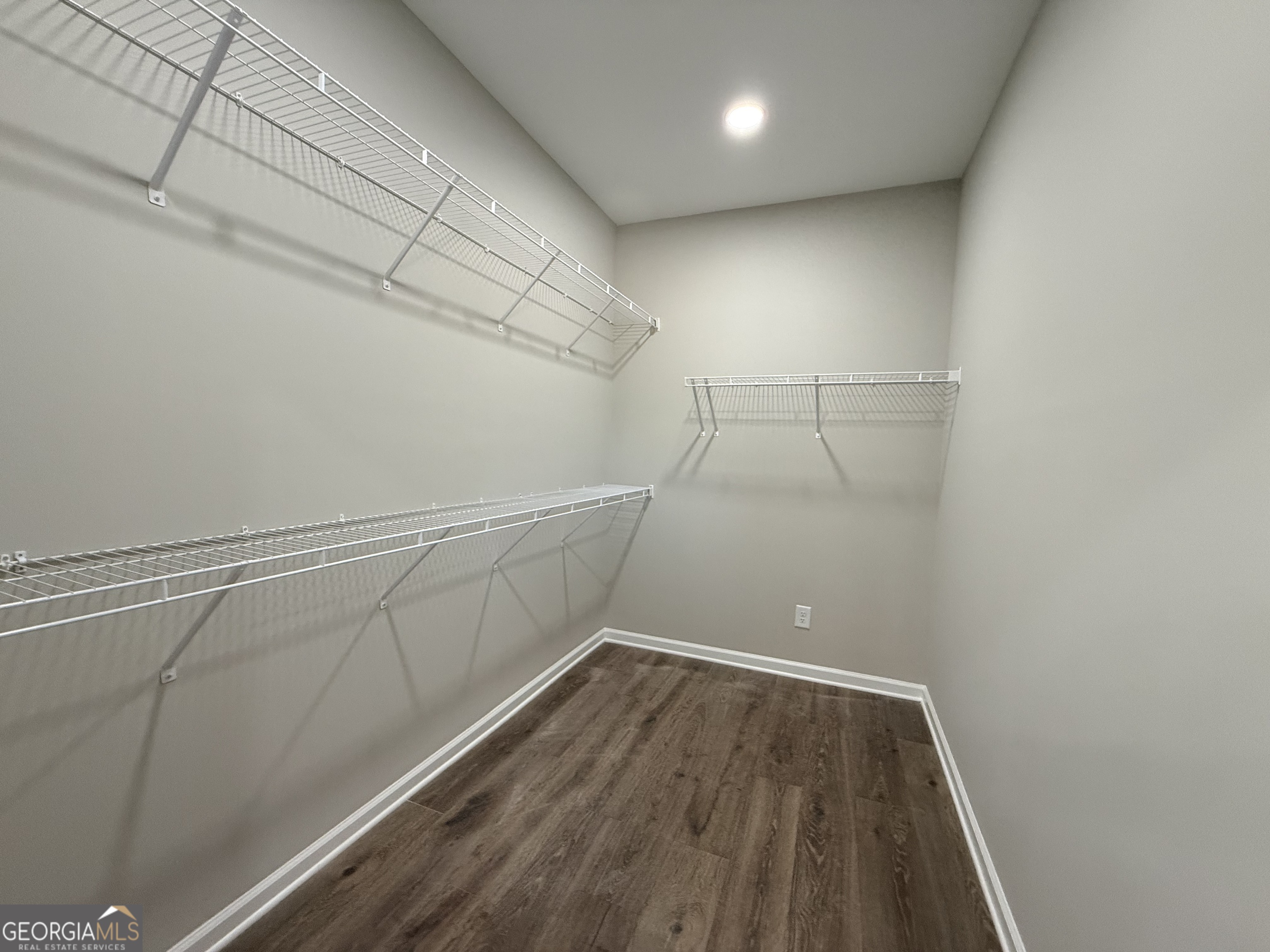 1205 Rocky Creek Road Hampton, GA 30228 - Photo 28 of 55 a view of a room with racks on the wall