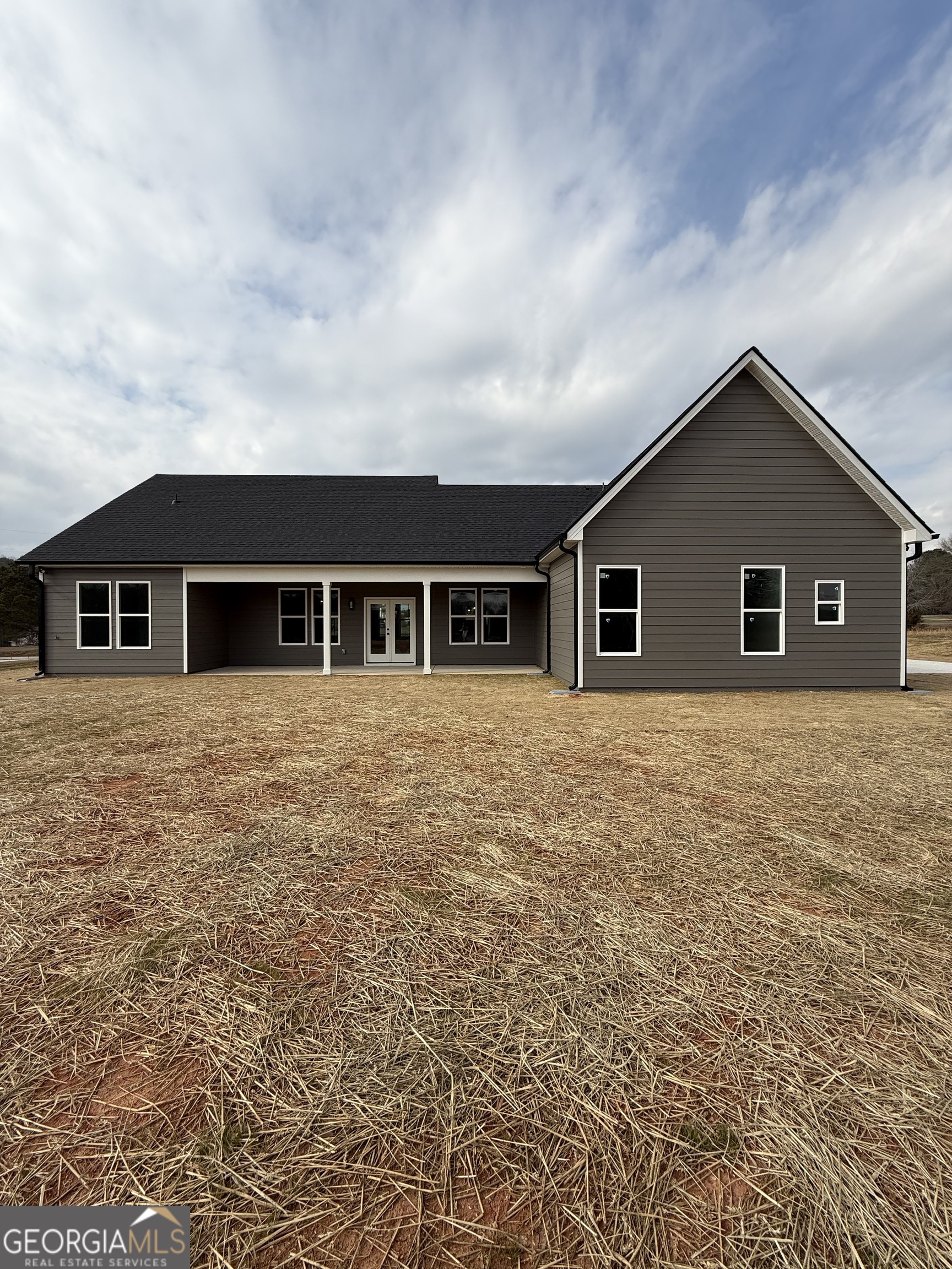 1205 Rocky Creek Road Hampton, GA 30228 - Photo 3 of 55 a house view with a garden space