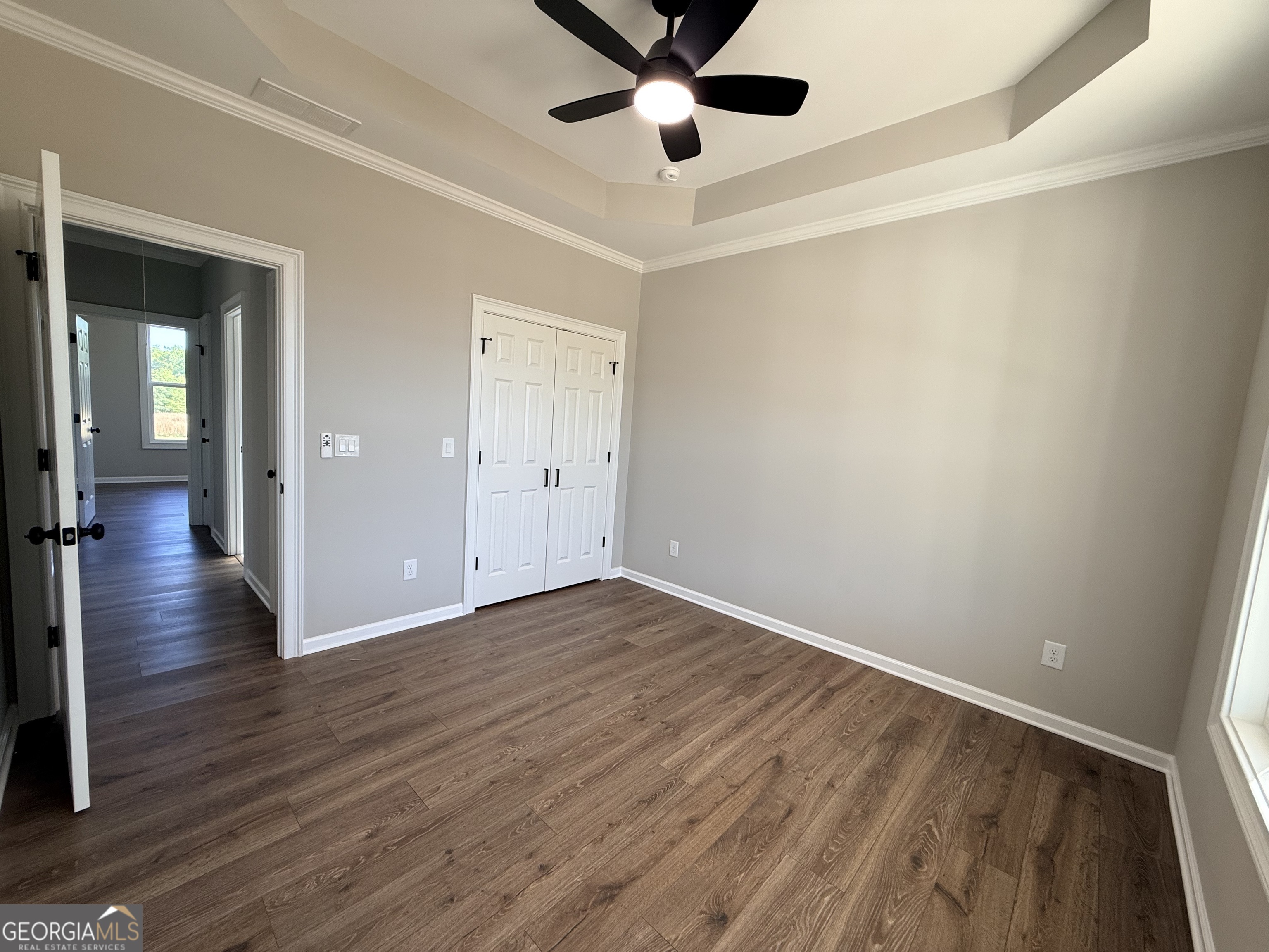 1205 Rocky Creek Road Hampton, GA 30228 - Photo 31 of 55 wooden floor in an empty room with a window