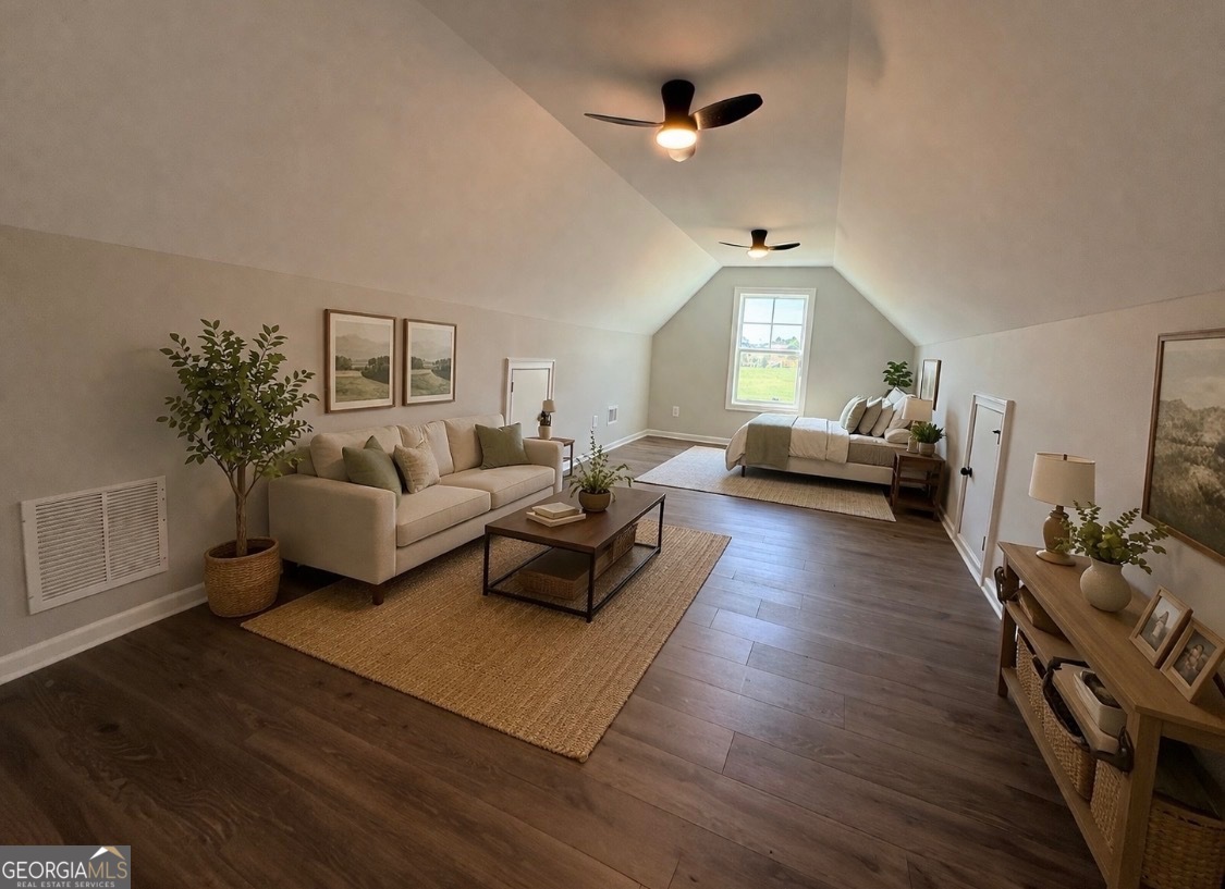 1205 Rocky Creek Road Hampton, GA 30228 - Photo 46 of 55 a living room with furniture and a wooden floor