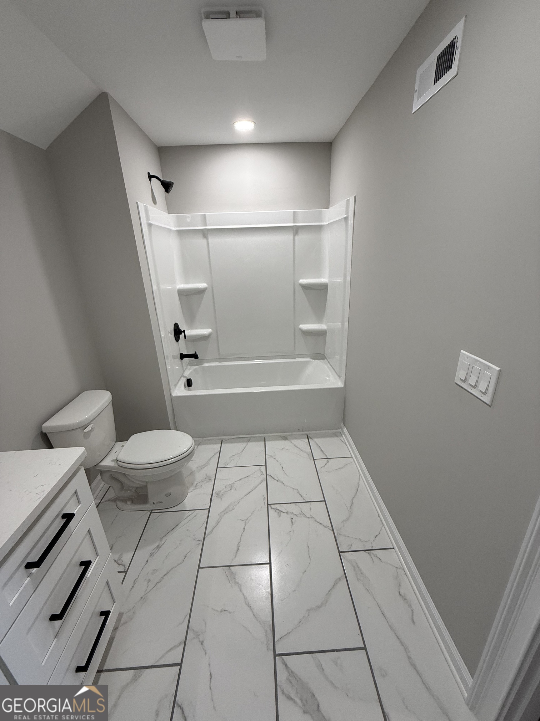 1205 Rocky Creek Road Hampton, GA 30228 - Photo 51 of 55 a bathroom with a toilet and a shower