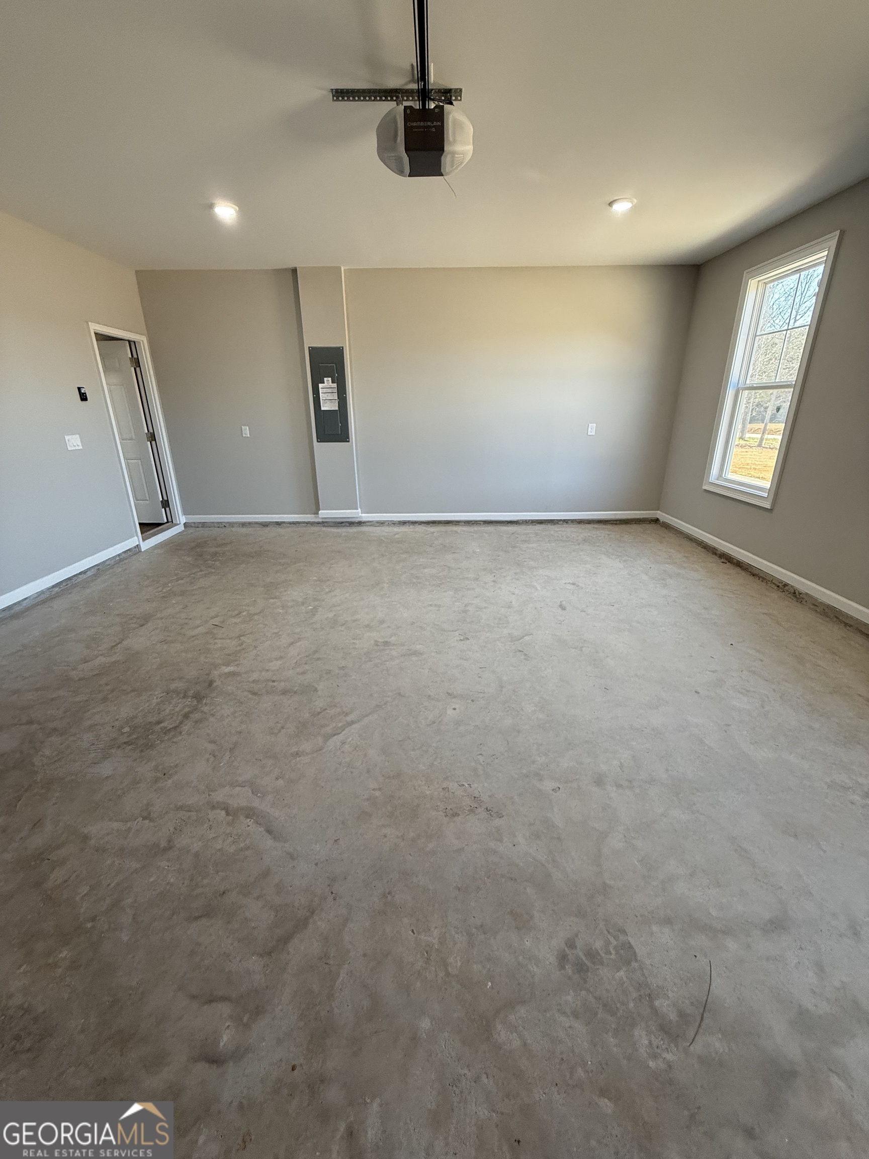 1205 Rocky Creek Road Hampton, GA 30228 - Photo 55 of 55 an empty room with windows and entrance