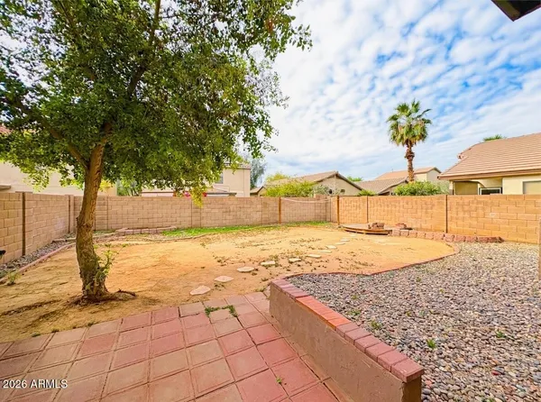 a view of a backyard of the house